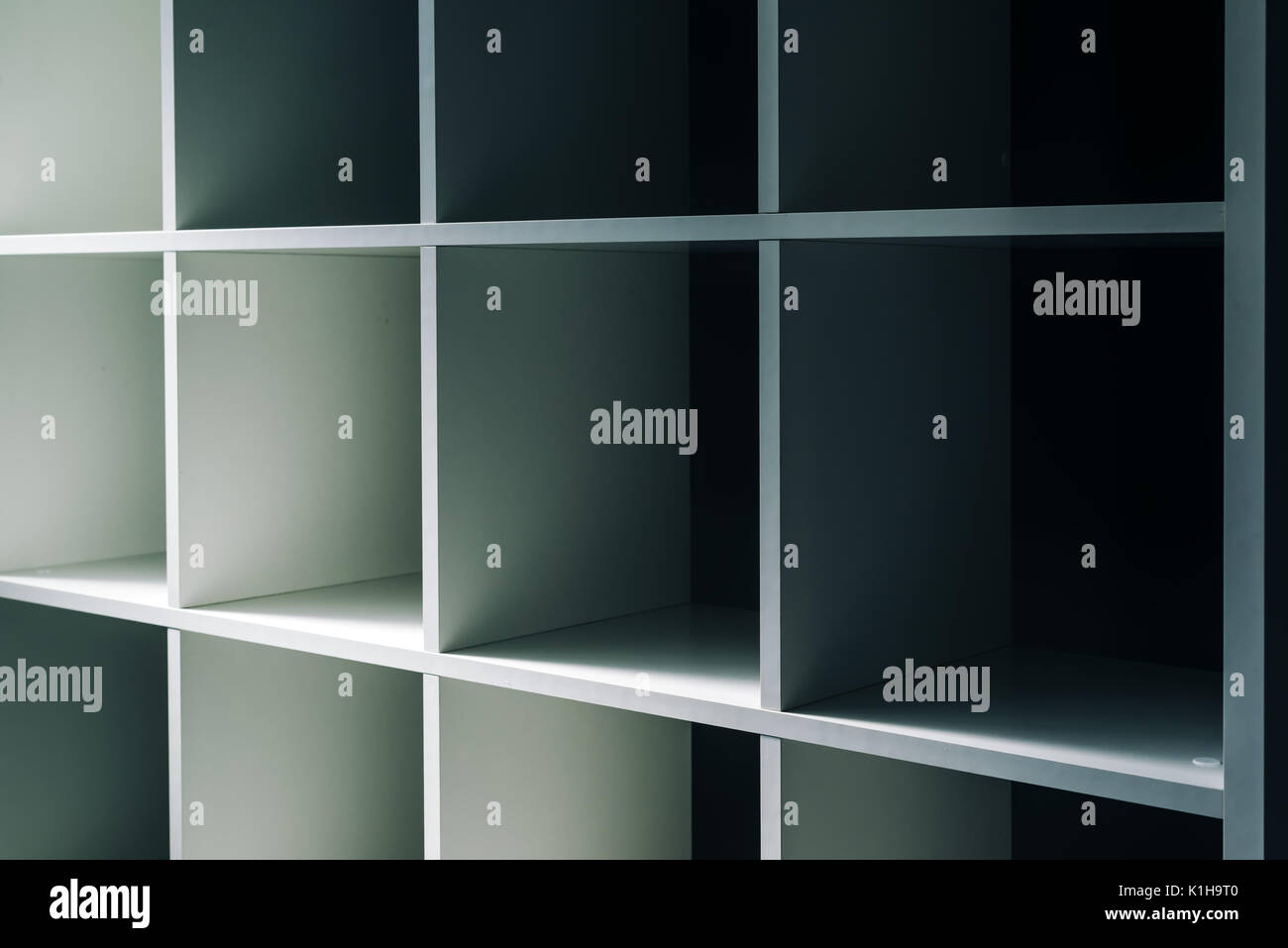 Empty office or bookcase library shelves with blank copy space for