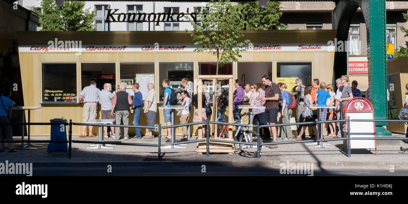 BERLIN-JUNE 3: Unidentified people in queue,outside the Konnopke's Imbiss, a legendary snack stall in Prenzlauer berg,Berlin,Germany,on June 3,2011. Stock Photo