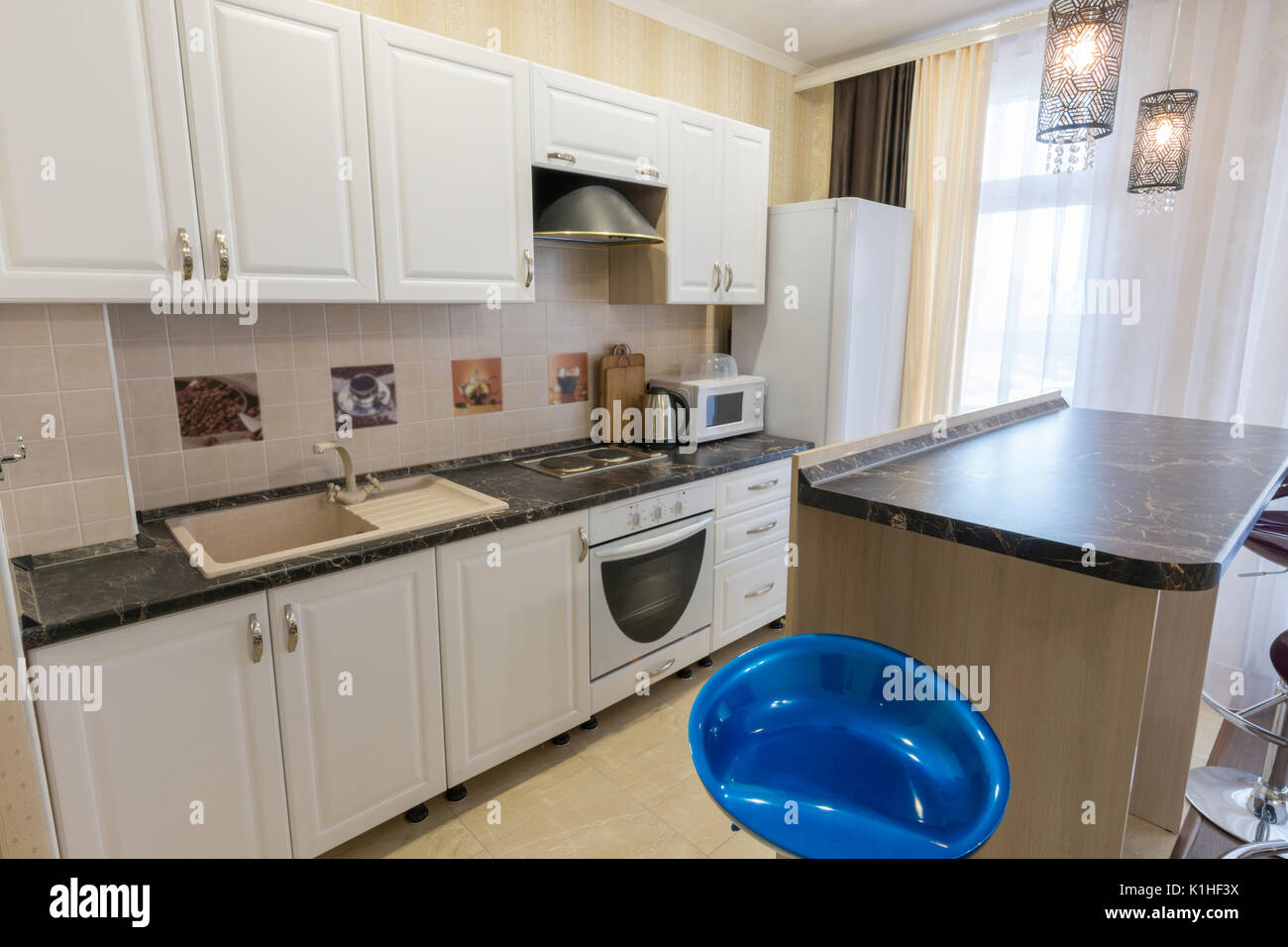 Interior of a one-room apartment, view of a kitchen set Stock Photo - Alamy