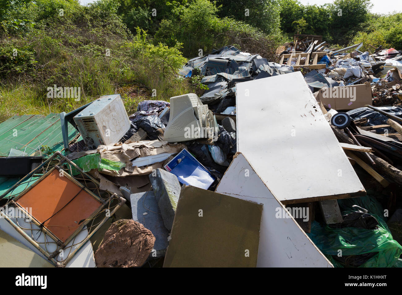 Illegally Dumped Domestic and Industrial Waste on Private Land in Essex Stock Photo