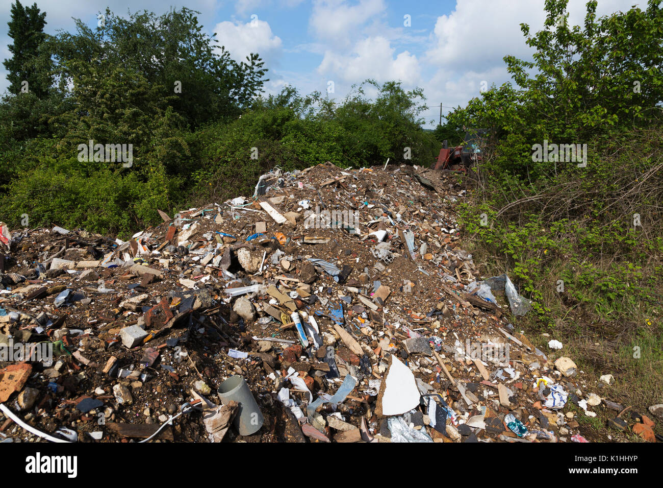 Illegally Dumped Domestic and Industrial Waste on Private Land in Essex Stock Photo