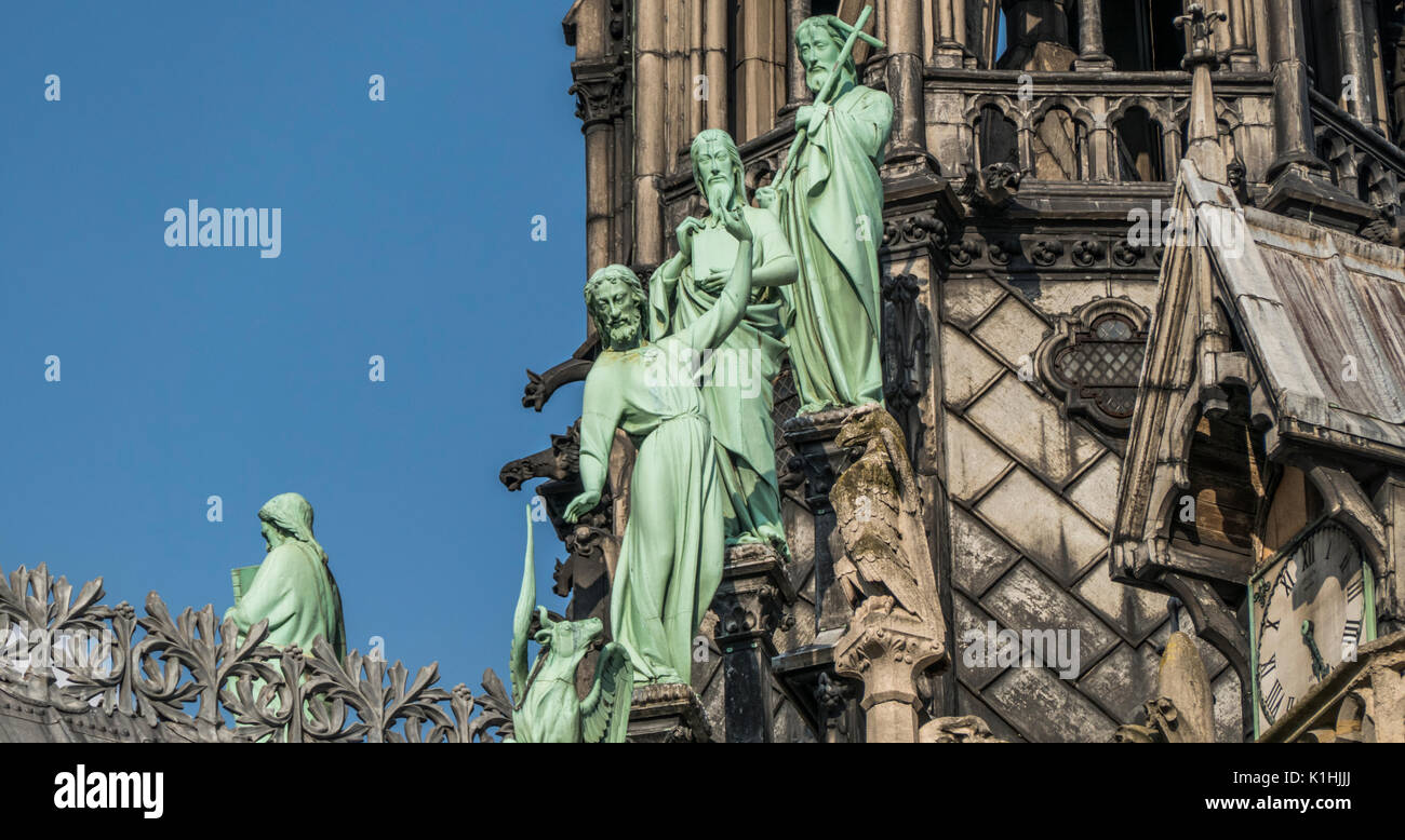 Apostles Statues On The Roof Spire Of Notre Dame Cathedral, Against A ...