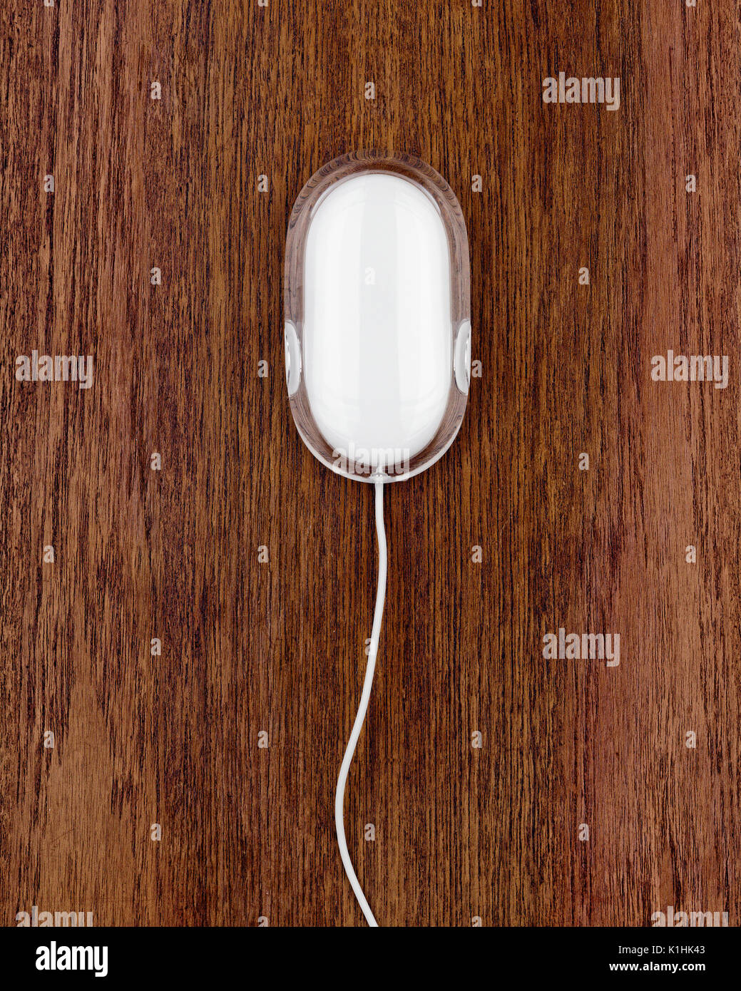 A mouse on a wooden background Stock Photo