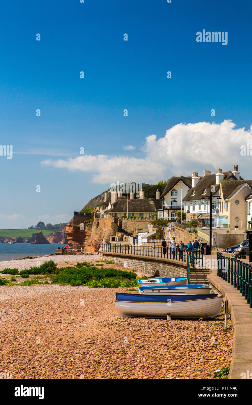 Thatched houses and cottages are found at one end of the promenade in Sidmouth, Devon, England, UK Stock Photo