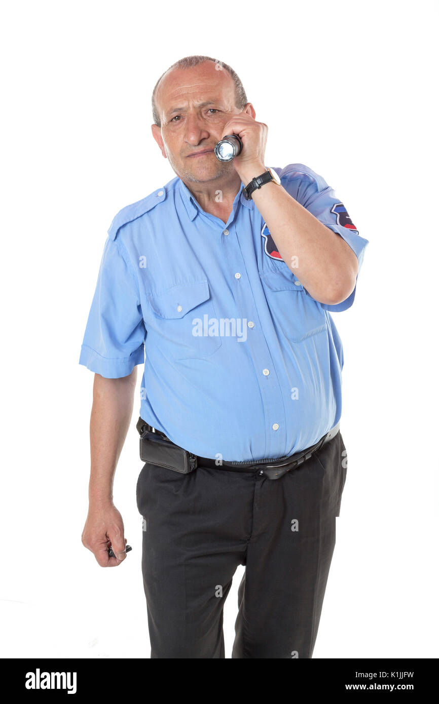 Senior security guy is trying to find something on white. He is using ...