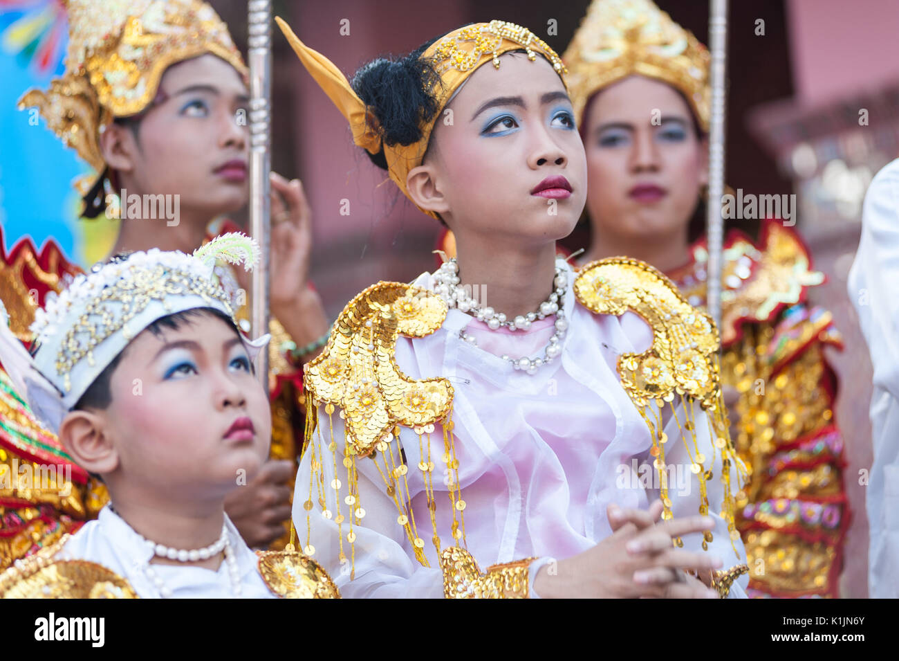 Two young boys dressed in ceremonial prince costumes during religious festivities at Taung Min Gyi Pagoda, Amarapura, Myanmar. Stock Photo