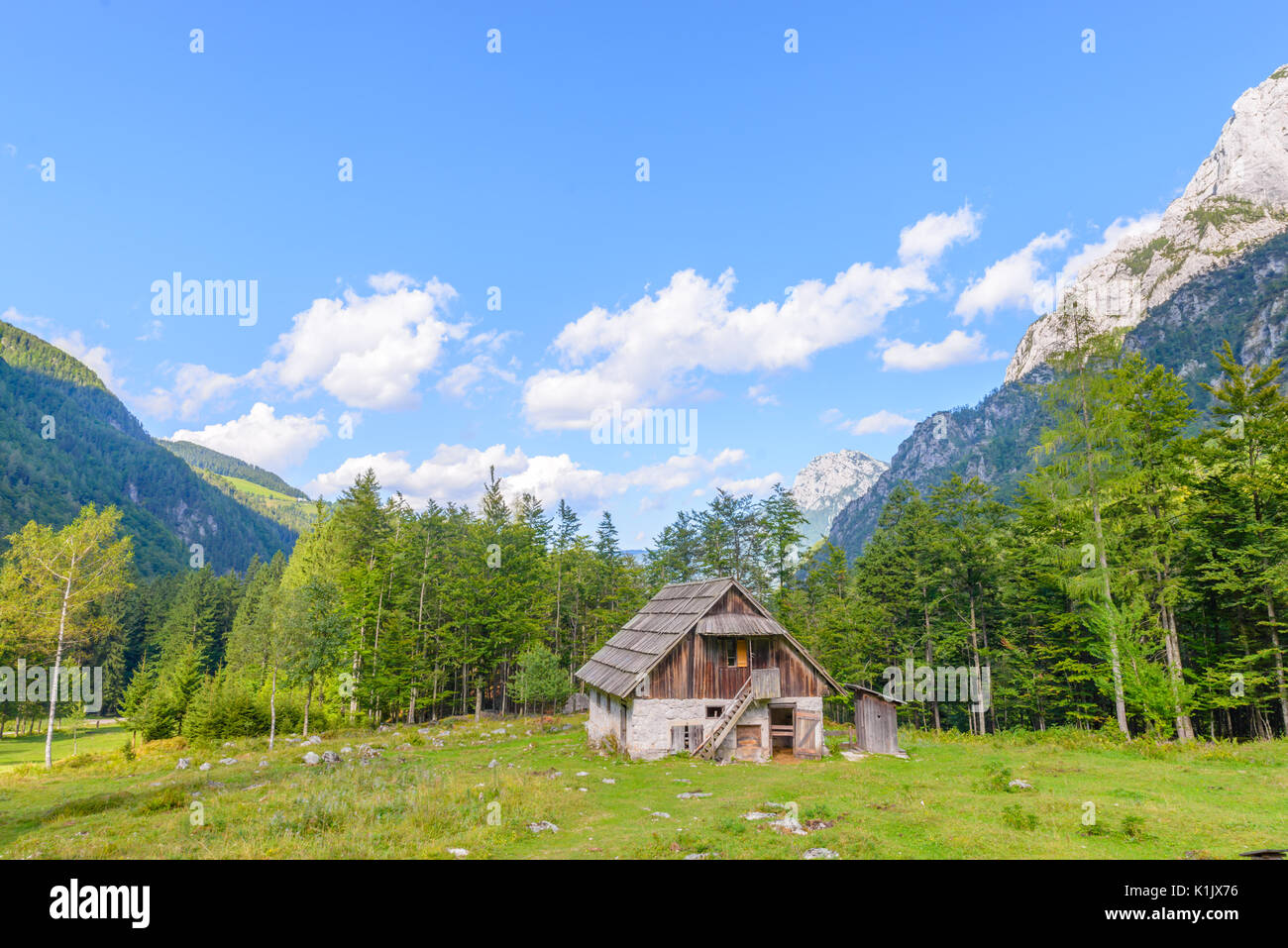 Mountain cabin, hut in European Alps, located in Robanov kot, Slovenia, popular hiking and climbing place with picturescue view Stock Photo