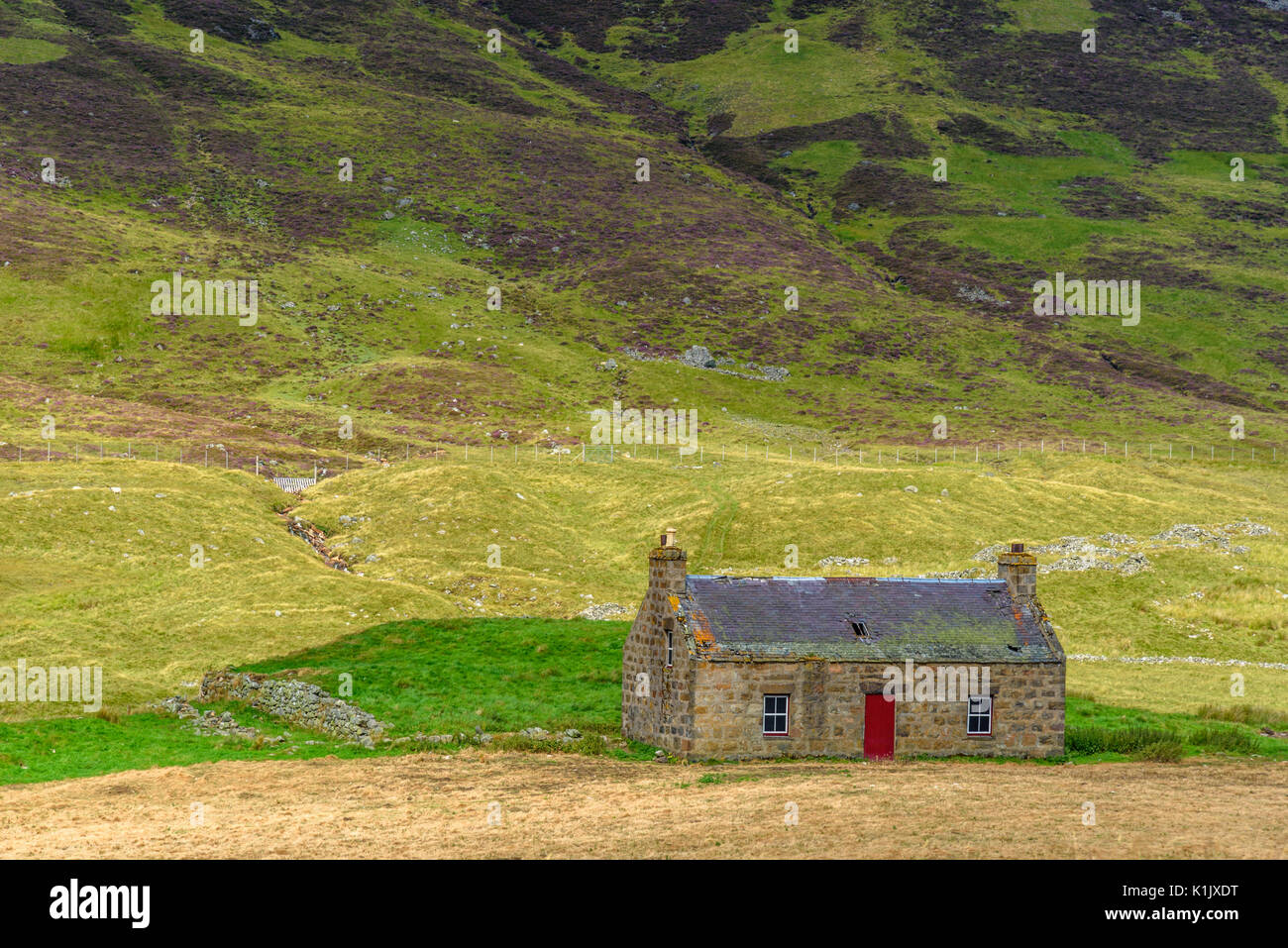 An abandoned building along a road in the Cairngorms National Park in Scotland Stock Photo