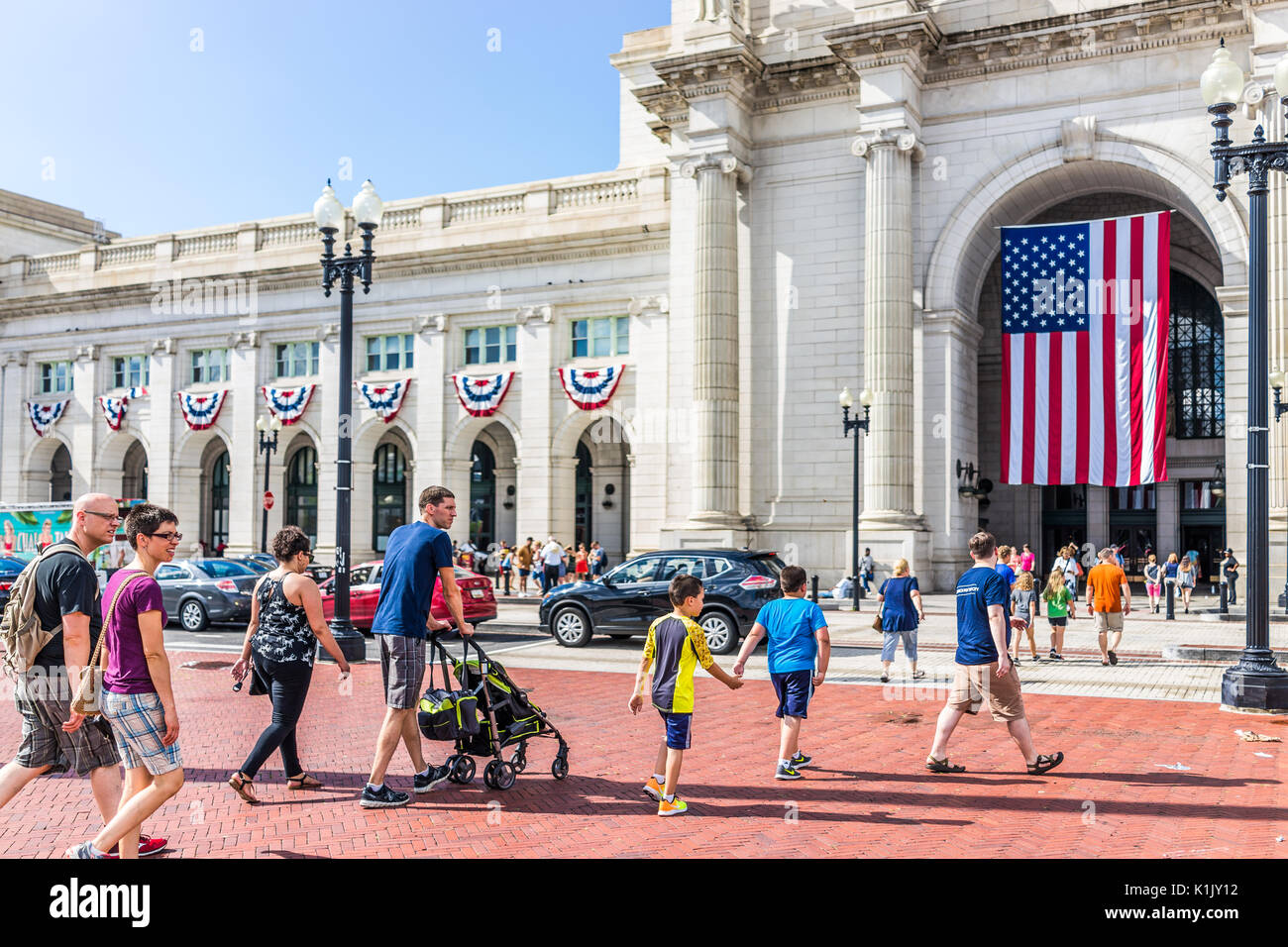 Washington DC, USA July 1, 2017 Union Station on columbus circle with family people crossing