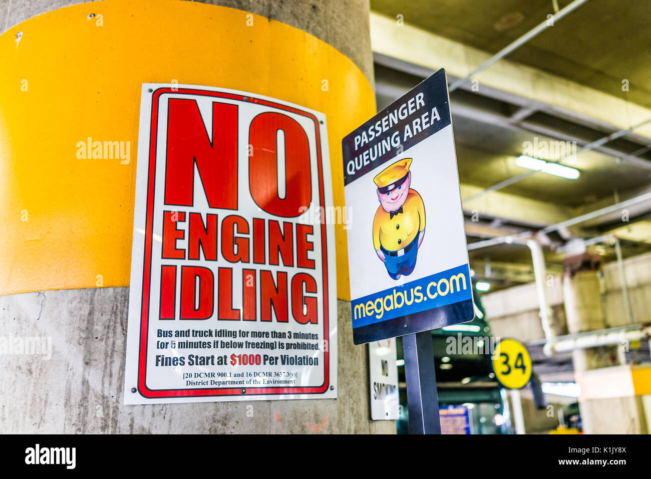 Washington DC, USA - July 1, 2017: Inside Union Station parking garage for buses in capital city with no engine idling sign Stock Photo