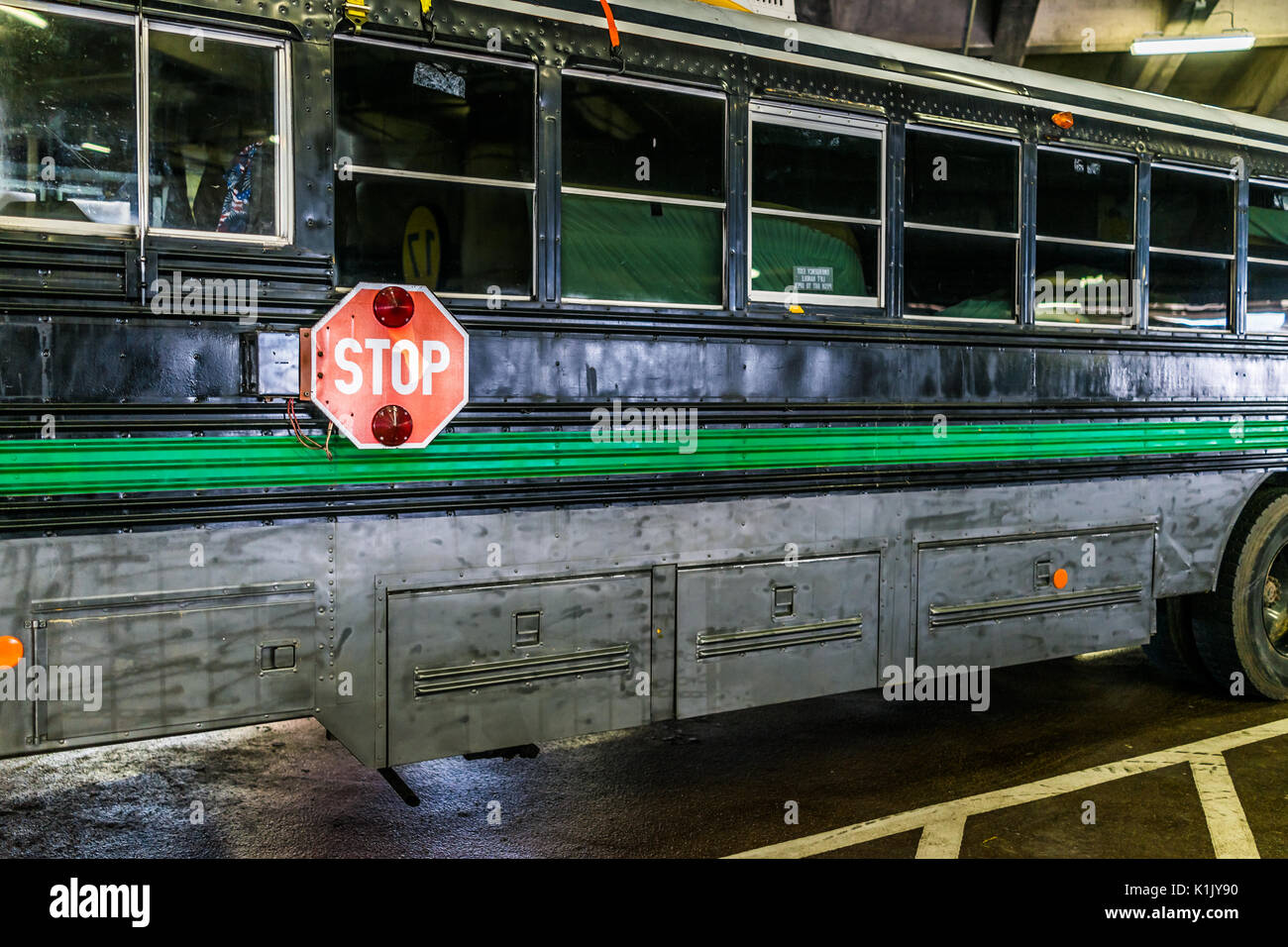 Washington DC, USA - July 1, 2017: Inside Union Station parking garage with black painted converted school bus Stock Photo