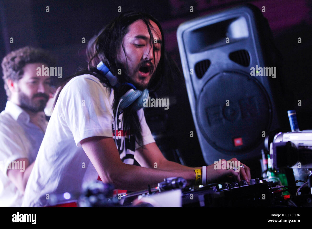 DJ Steve Aoki performing as Danny Masterson watches background Hard Summer Festival Shrine Expo Hall Los Angeles July 19,2008. Stock Photo