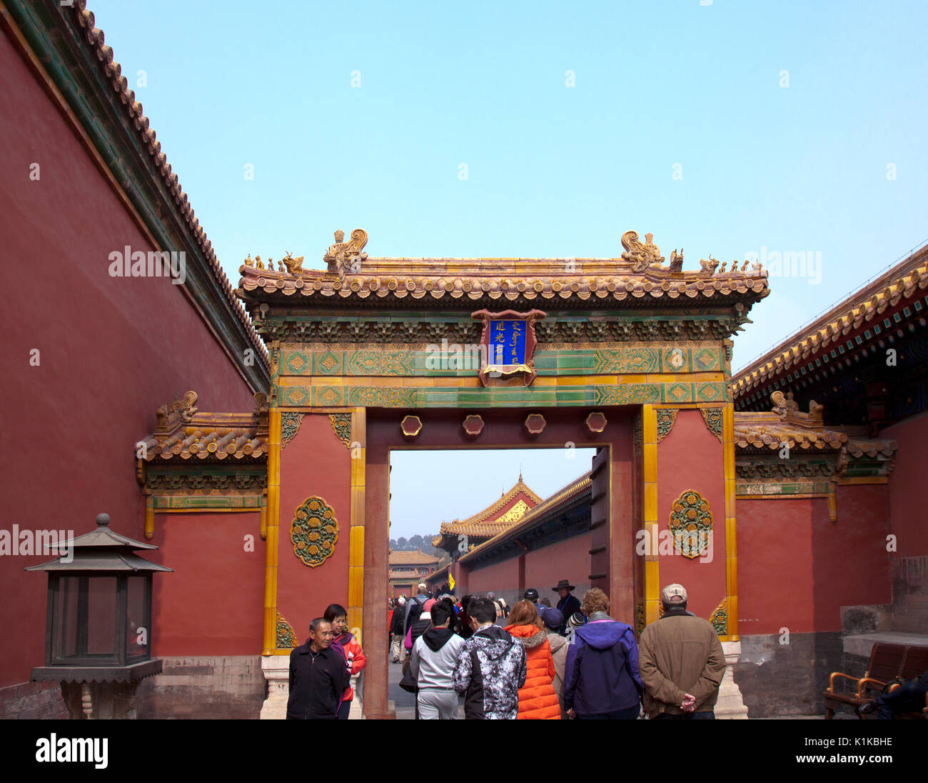 People passing through the Gate of Flourishing Blessings (architectural detail), Forbidden City, Beijing, China.  Built from 1406 to 1420 and containi Stock Photo
