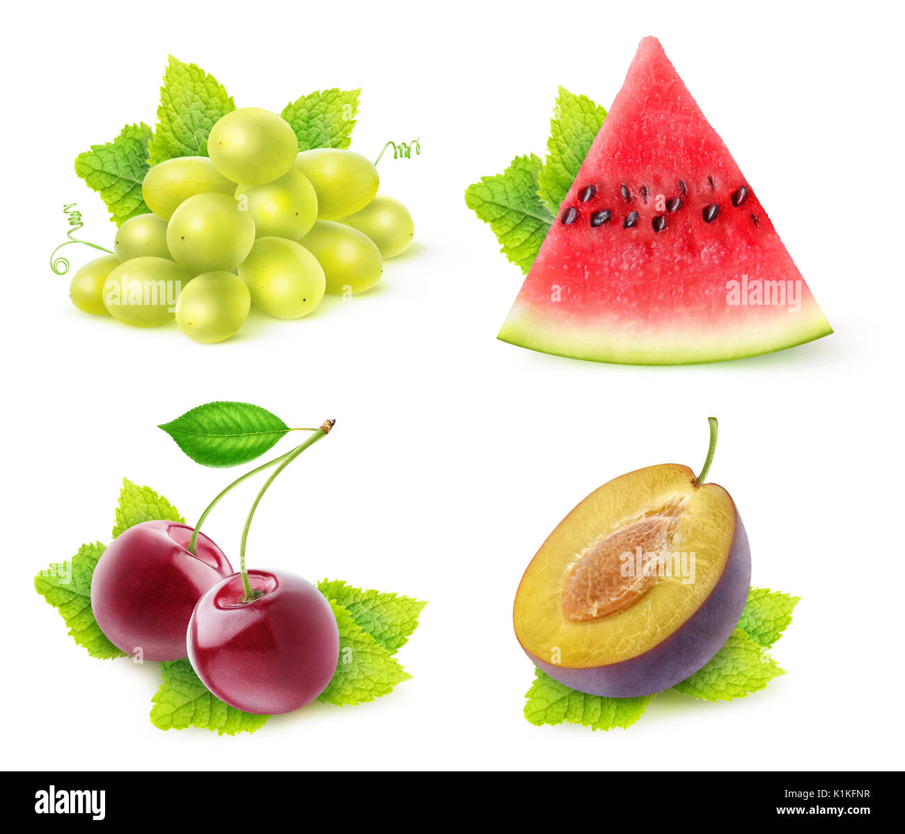 Isolated fruits with mint. Slice of watermelon, white grapes, cherries and half of plum fruit with mint leaves isolated on white background with clipp Stock Photo