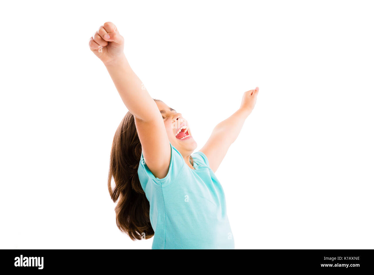 Studio portrait of a happy girl with arms raised on air Stock Photo - Alamy