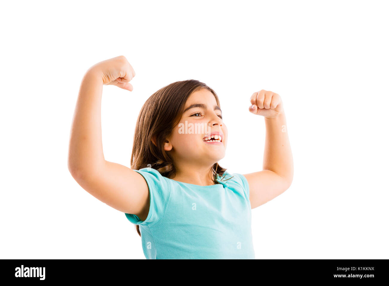 Studio portrait of a happy girl with arms raised on air Stock Photo - Alamy