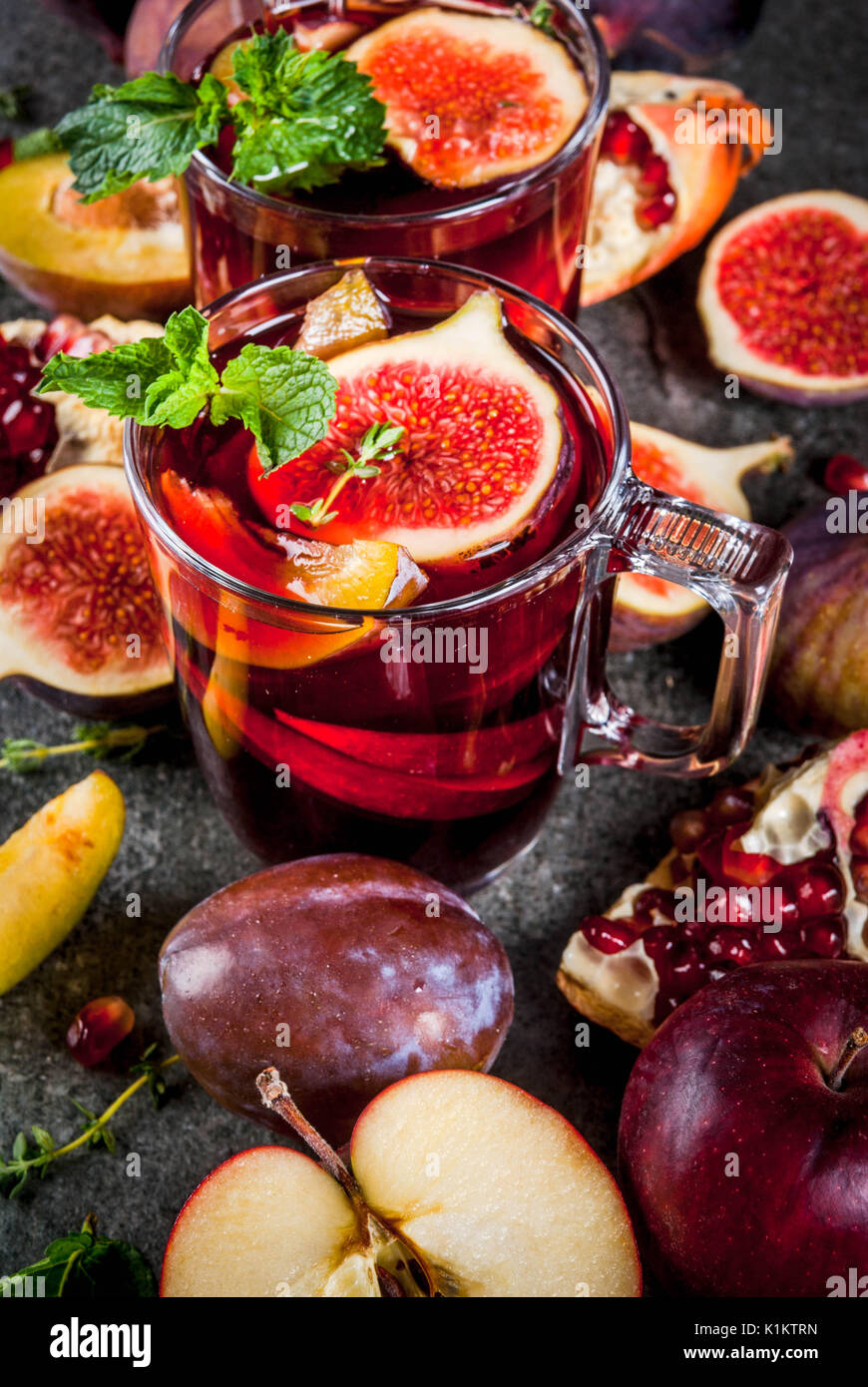 Warming autumn, winter cocktail drinks recipes. Hot red fruit sangria ...