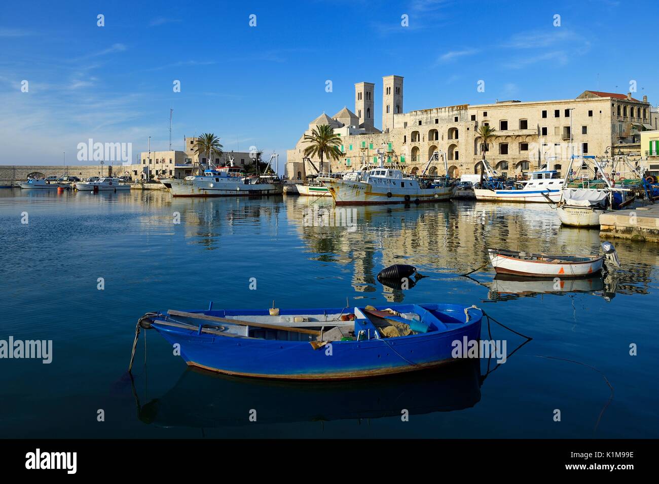 Harbour with old fishing boats, at back cathedral, San Corrado, Molfetta, province of Bari, Apulia, Italy Stock Photo