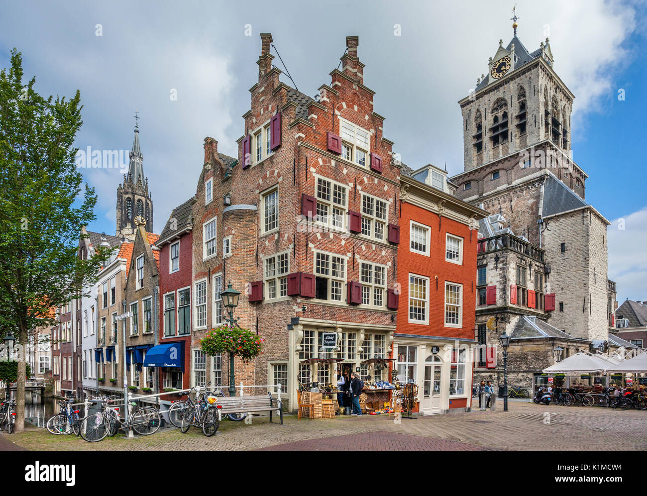 Netherlands, South Holland, center of old Delft, fine samples of dutch architecture at the corner Voldersgracht and  Market Square with view of the Ci Stock Photo