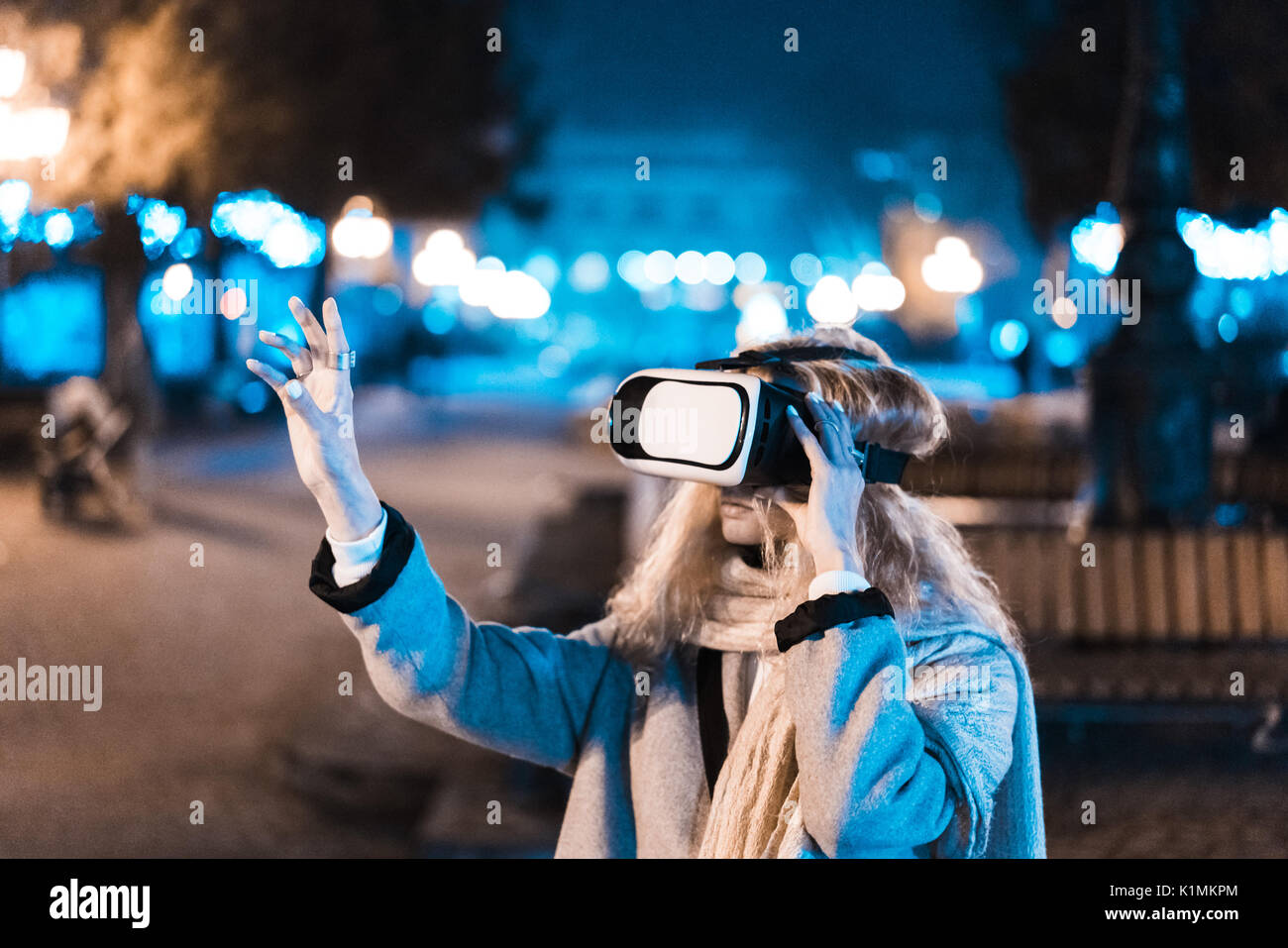 Young girl getting experience VR headset, is using augmented reality ...