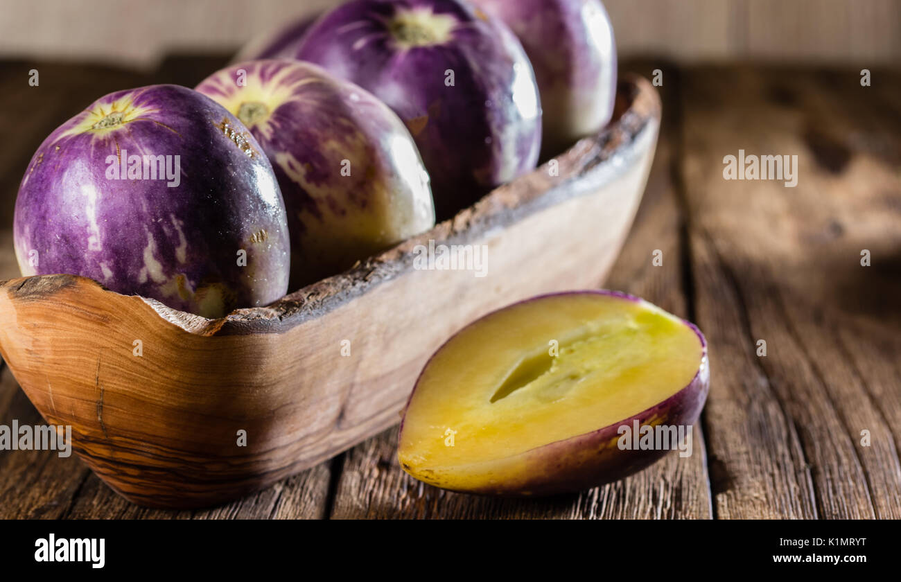 South American fruit sweet cucumber. Pepino dulce or pepino melon on wooden background Stock Photo