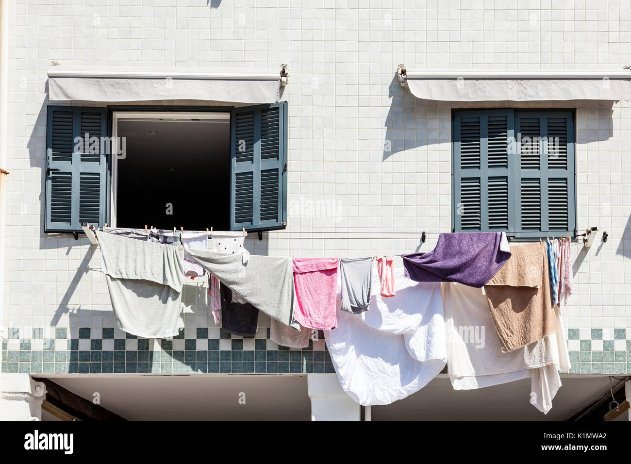 Fresh laundry hanging between two windows in the city of San Sebastian, Donostia. Basque country, Spain Stock Photo
