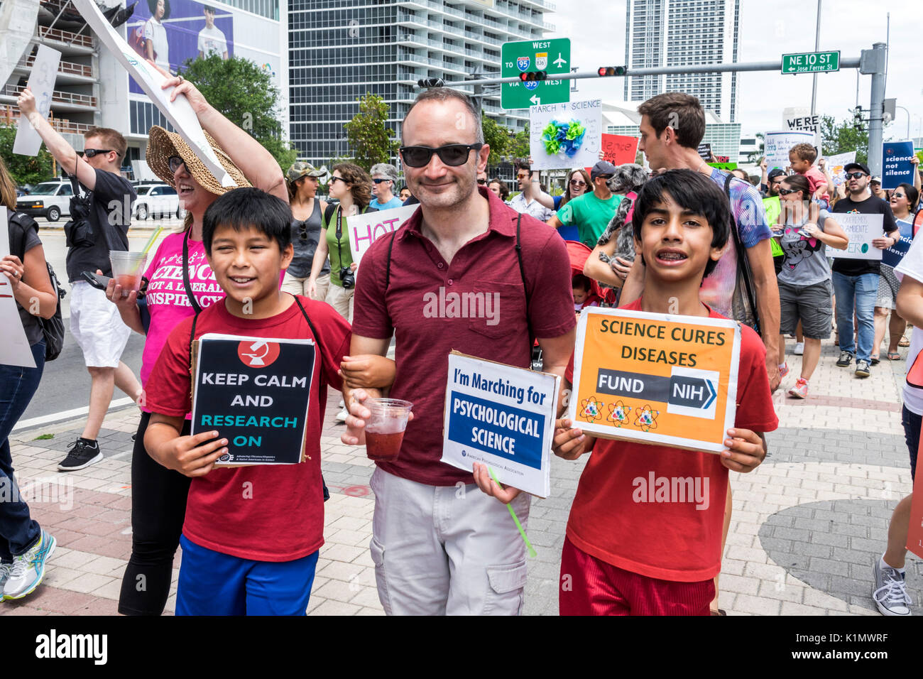 Miami Florida,Museum Park,March for Science,protest,rally,sign,protester,marching,signs,posters,student students pupil Hispanic boy boys,male kid kids Stock Photo