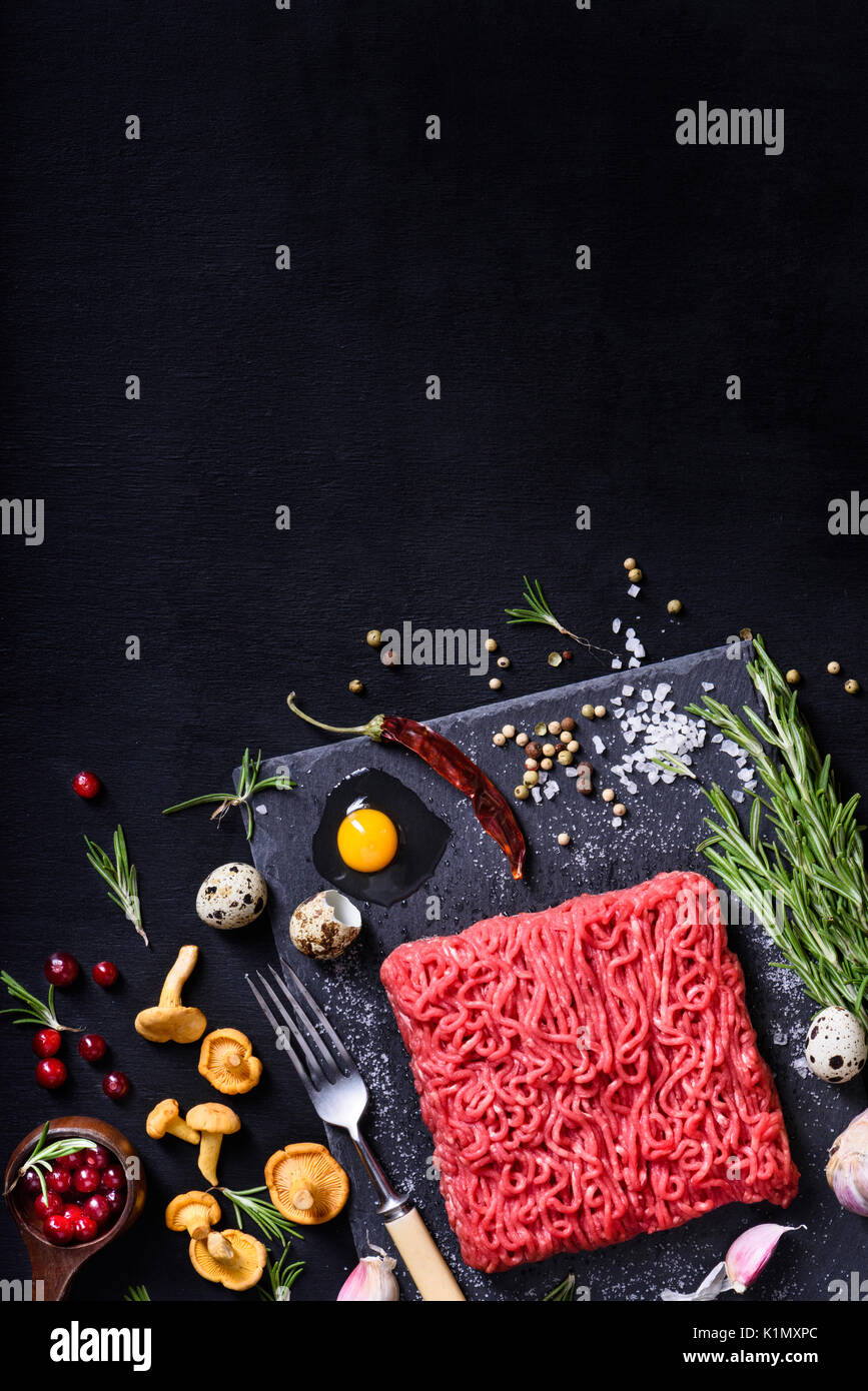 Raw Meat Raw Beef Steak Minced On A Cutting Board With Rosemary And Spices Above View Copy 