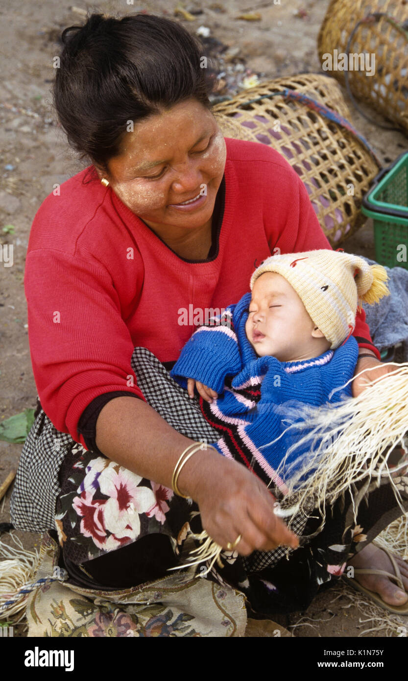 Woman with sleeping baby, Kengtung (Kyaingtong), Burma (Myanmar) Stock Photo