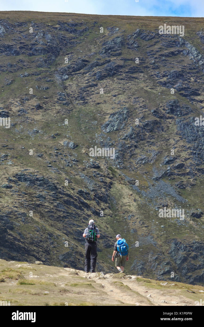 Hillwalkers in the Lake District heading towards Blencathra Stock Photo