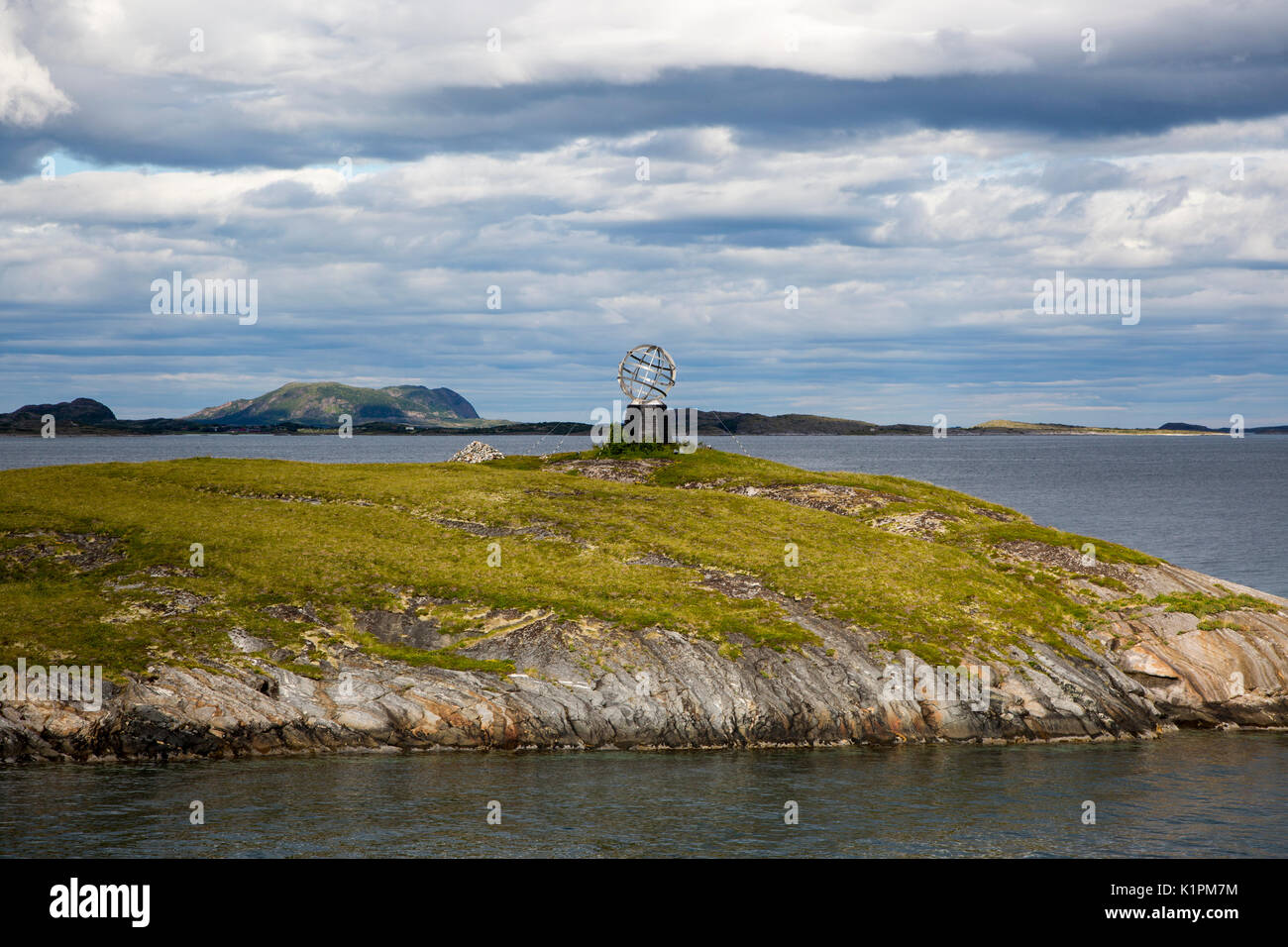 Monument marker to show crossing the Arctic Circle heading south on small island, Norway Stock Photo