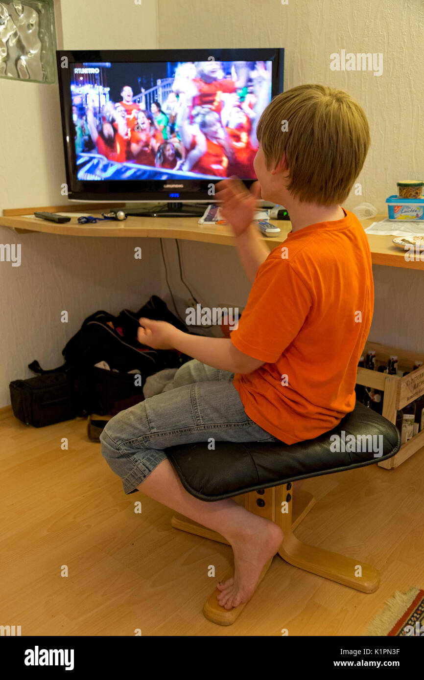 young boy watching TV Stock Photo