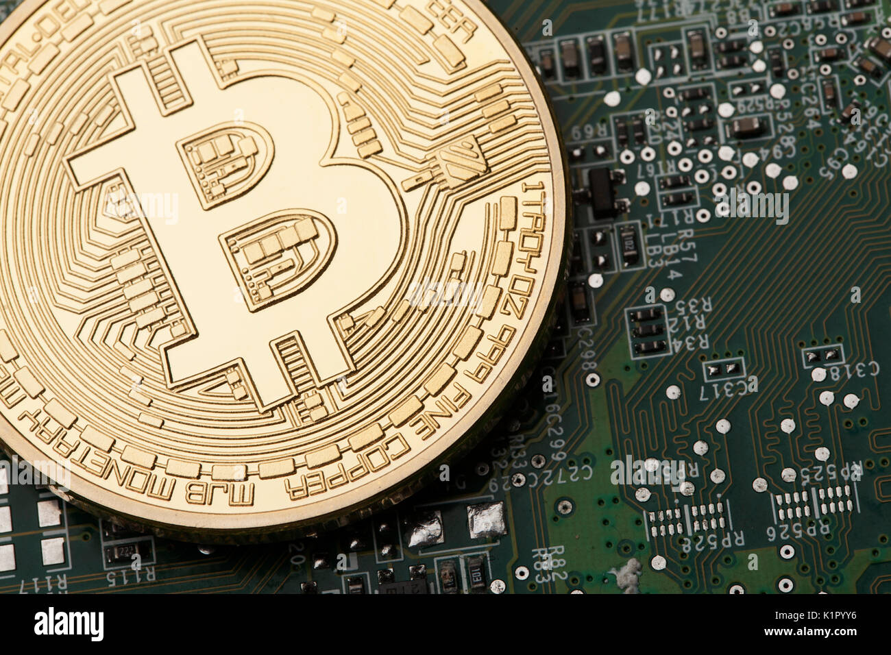 Virtual Currencies Bitcoin Example Golden Bitcoin virtual currency on a circuit board background Stock ...