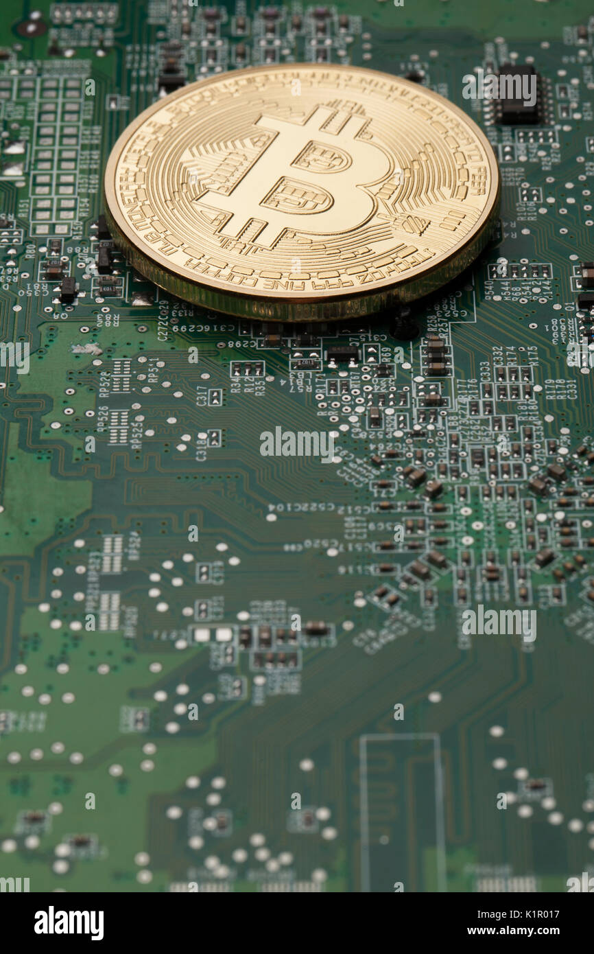 Virtual Currencies Bitcoin Example Golden Bitcoin virtual currency on a circuit board background Stock ...