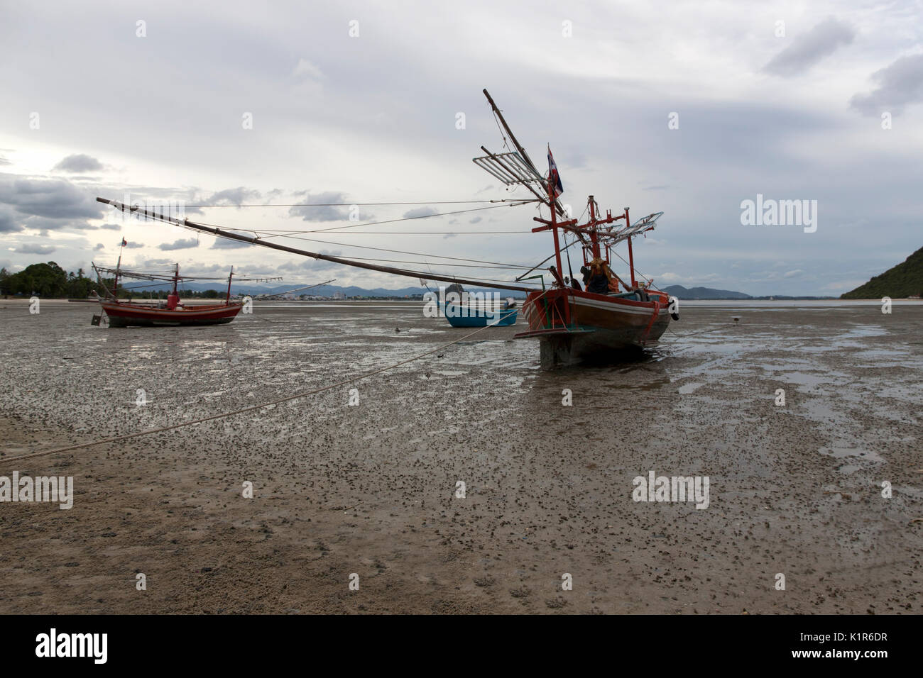 Fishing wood boat parked on Beach, the seaside in Thailand Stock Photo