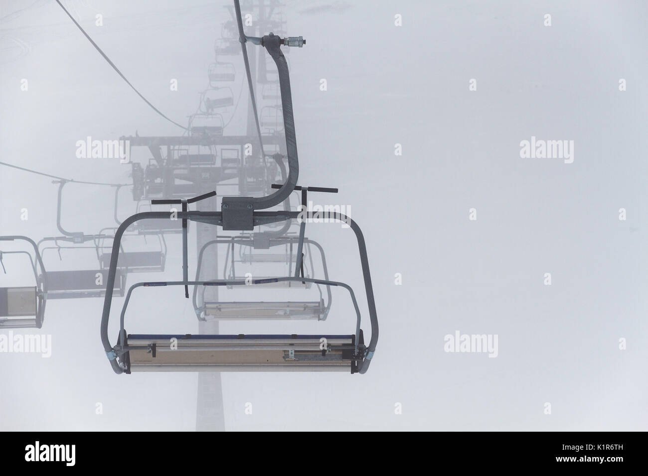 Empty Ski Lift Chair By Snowy Misty Winter Day Stock Photo Alamy