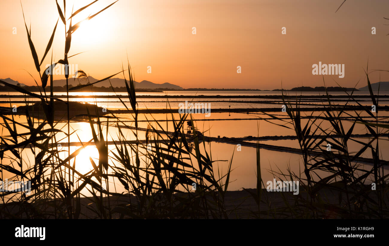 Marsala (Italy) - 'Saline dello Stagnone', sunset view of the mills and salt pans of Ettore Infersa in Marsala, the largest lagoon in Sicily Stock Photo