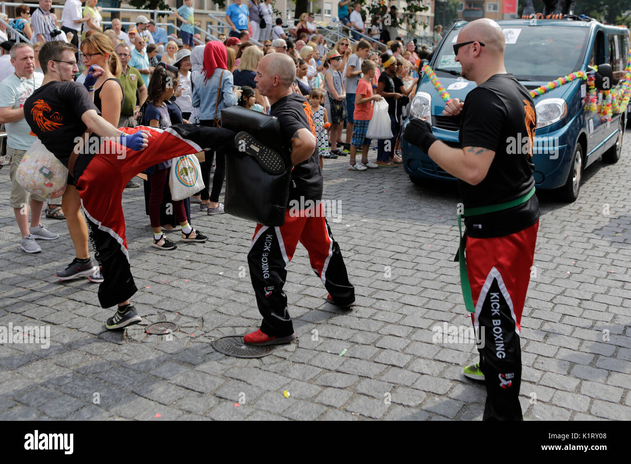 Worms, Germany. 27th August 2017. Kickboxing athletes demonstrate their sport. The first highlight of the 2017 Backfischfest was the big parade through the city of Worms with over 80 groups and floats. Community groups, music groups and business from Worms and further afield took part. Credit: Michael Debets/Alamy Live News Stock Photo