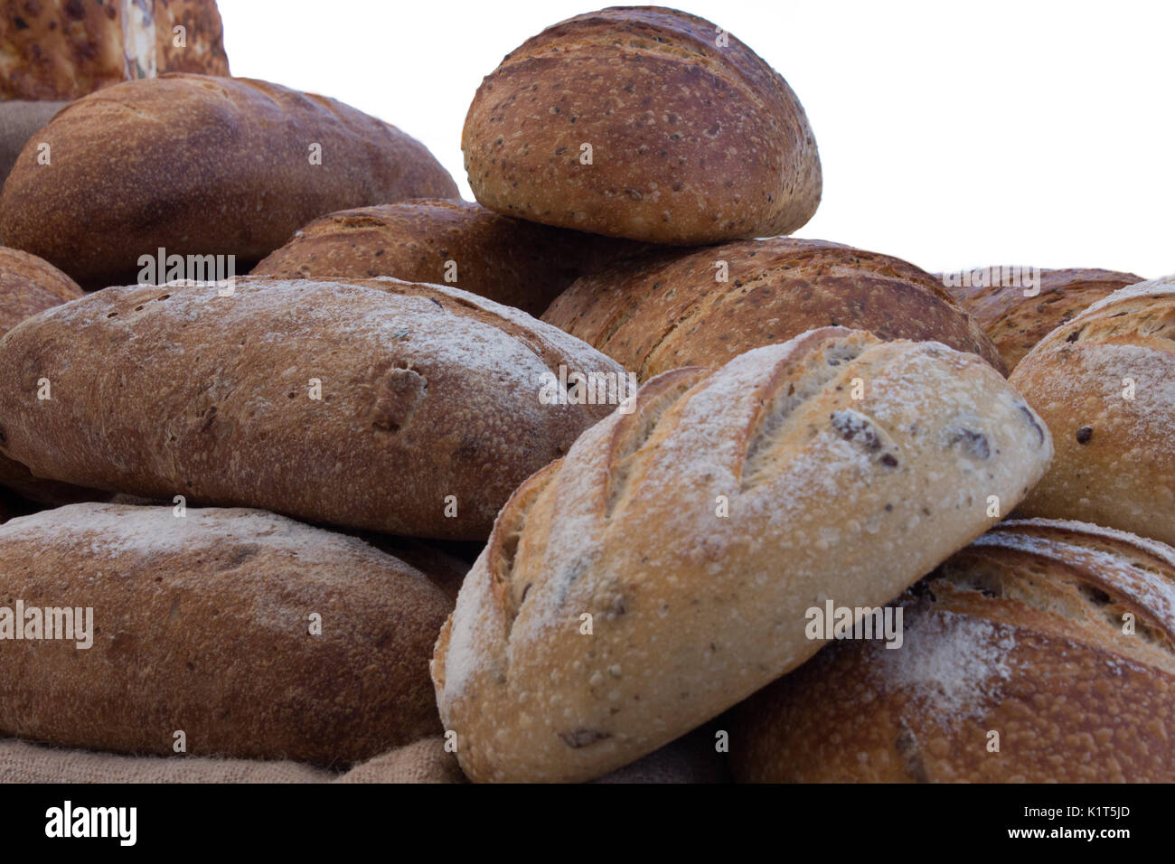 Freshly Baked Loaves Of Multigrain And Sourdough Bread Stock Photo - Alamy