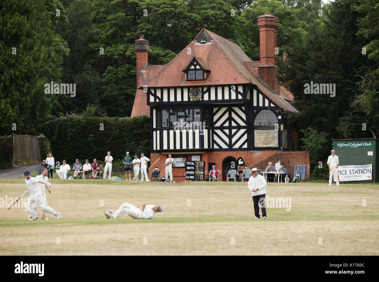 A village cricket match between Tilford and Grayswood is played on the green in Tilford, Surrey, on Saturday July 15, 2017 Stock Photo