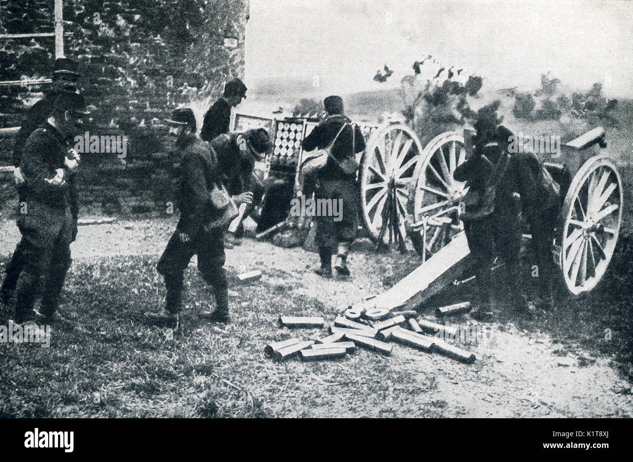 This photo taken in early World War I has the caption: French artillery in action, the gunners trying to protect their ear-drums from the shock. During Von Kluck's great drive on Paris, the french artillery did wonderful servie in holding their ground to the last possibe moment then retreating and taking up another defensive position. Stock Photo