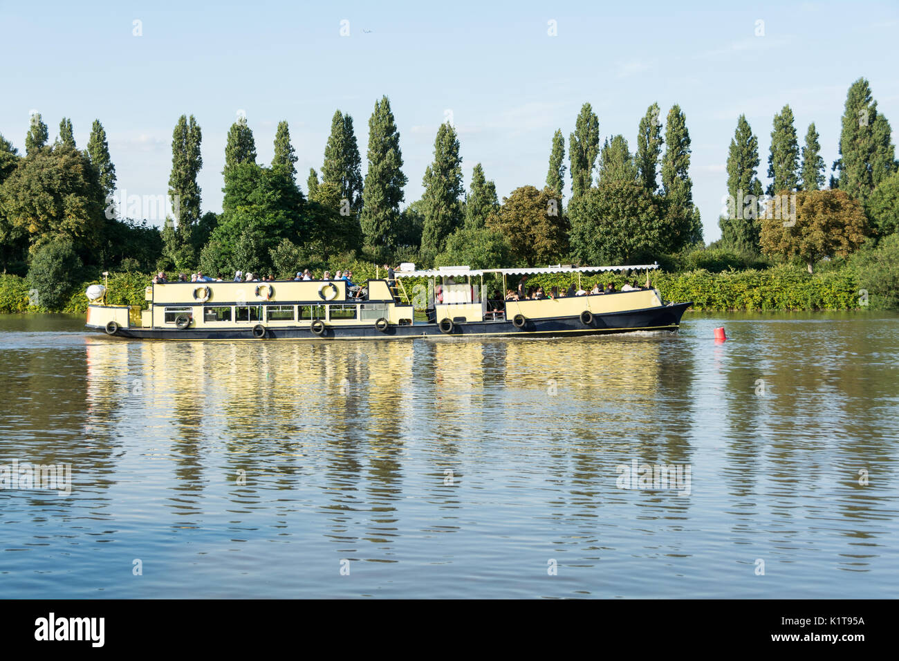 A pleasure boat on the river Thames in Mortlake, London, UK Stock Photo ...