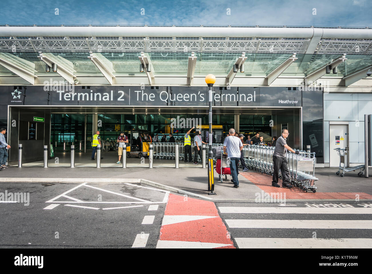 Luggage trolleys outside the entrance to Heathrow Airport Terminal Two