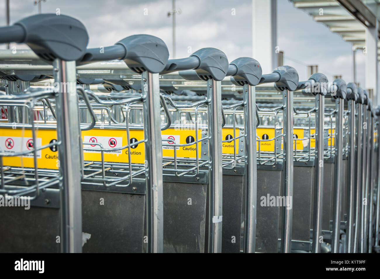 Luggage trolleys outside Heathrow Airport Terminal Two Building, London