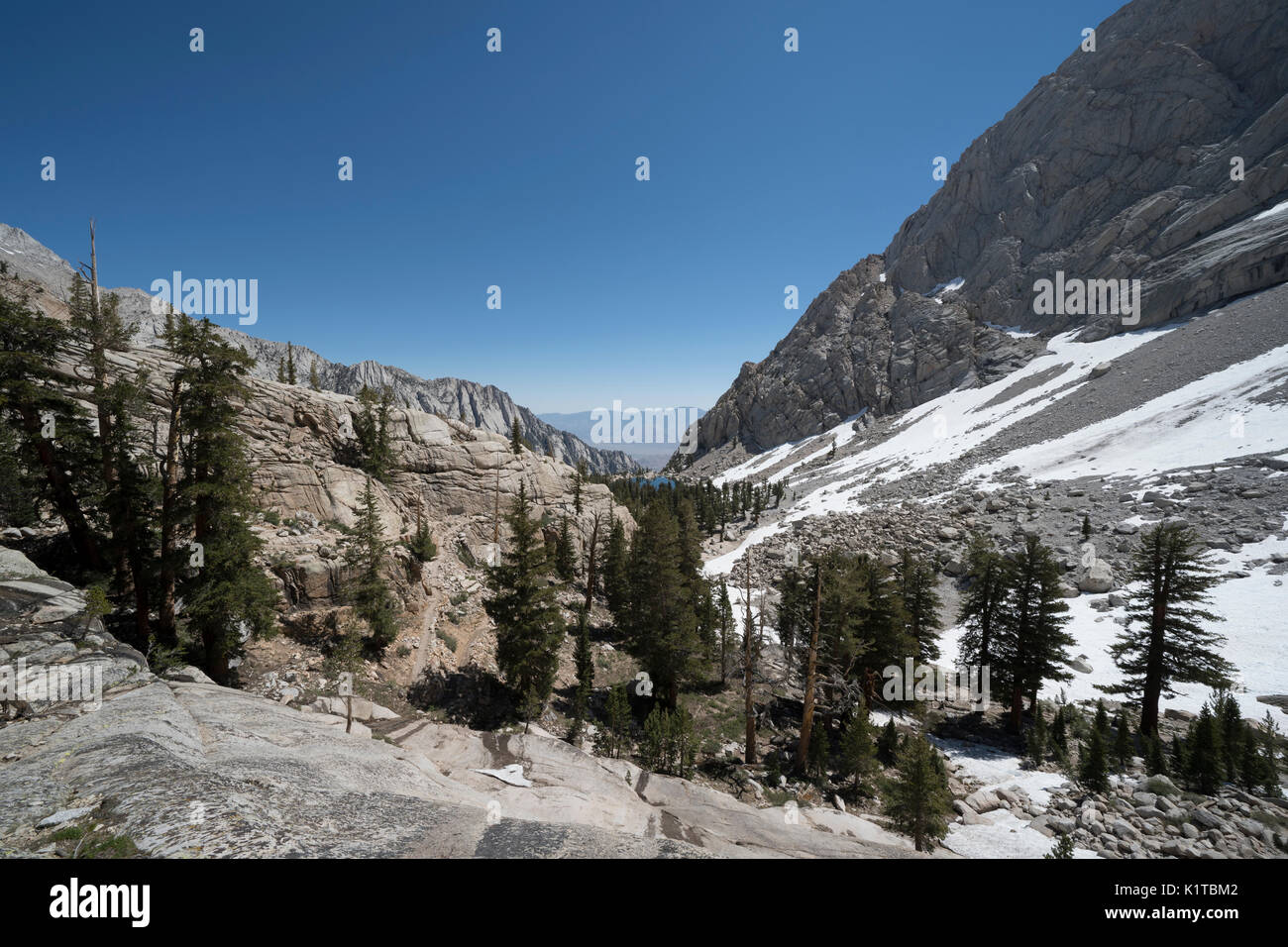 A view down the valley from the Mt. Whitney trail, with Lone Pine Lake in the distance Stock