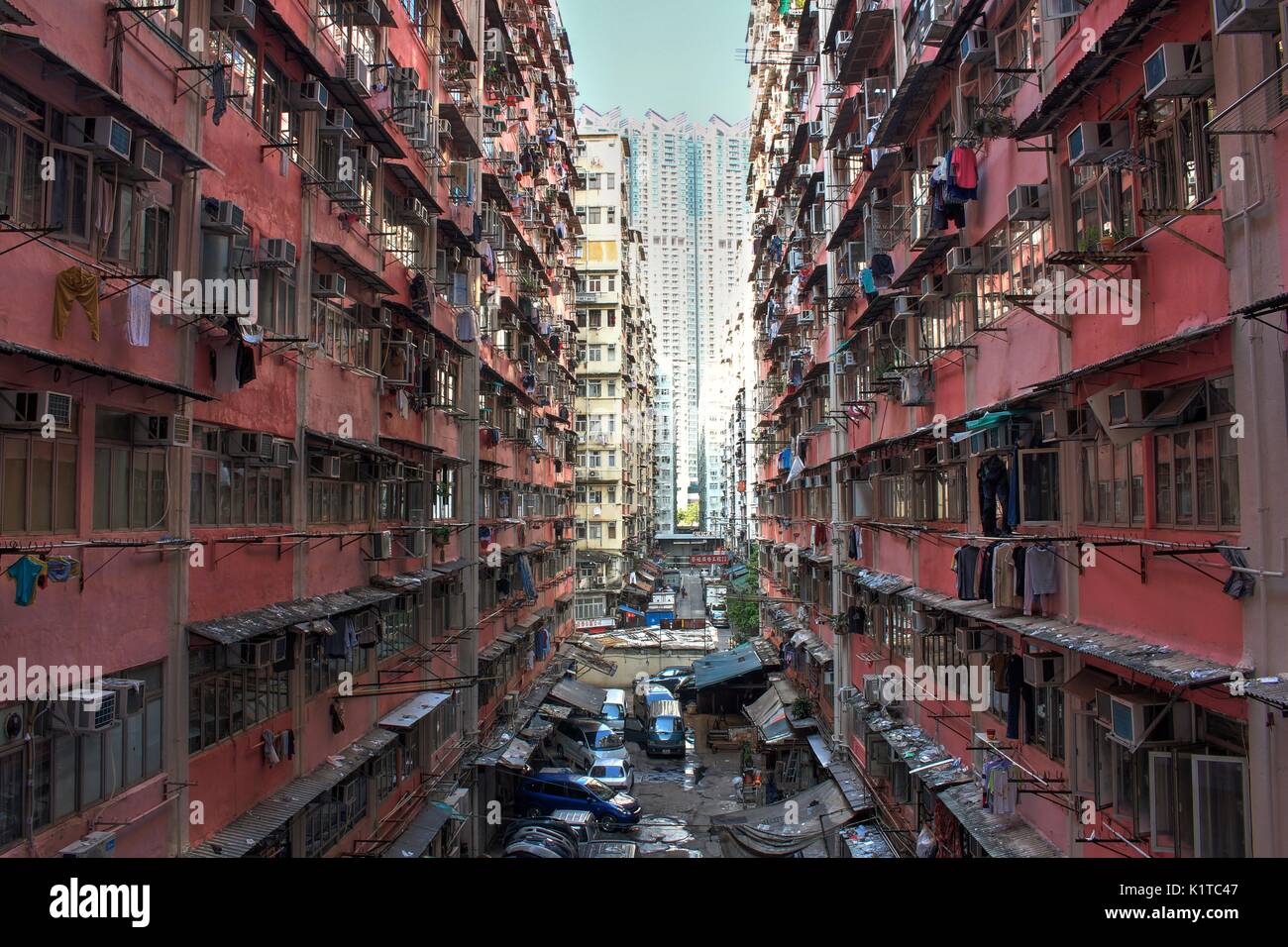 Crowded government built public housing in old district of Hong Kong, China, with the contrast of luxury public condominium in the background, concept Stock Photo