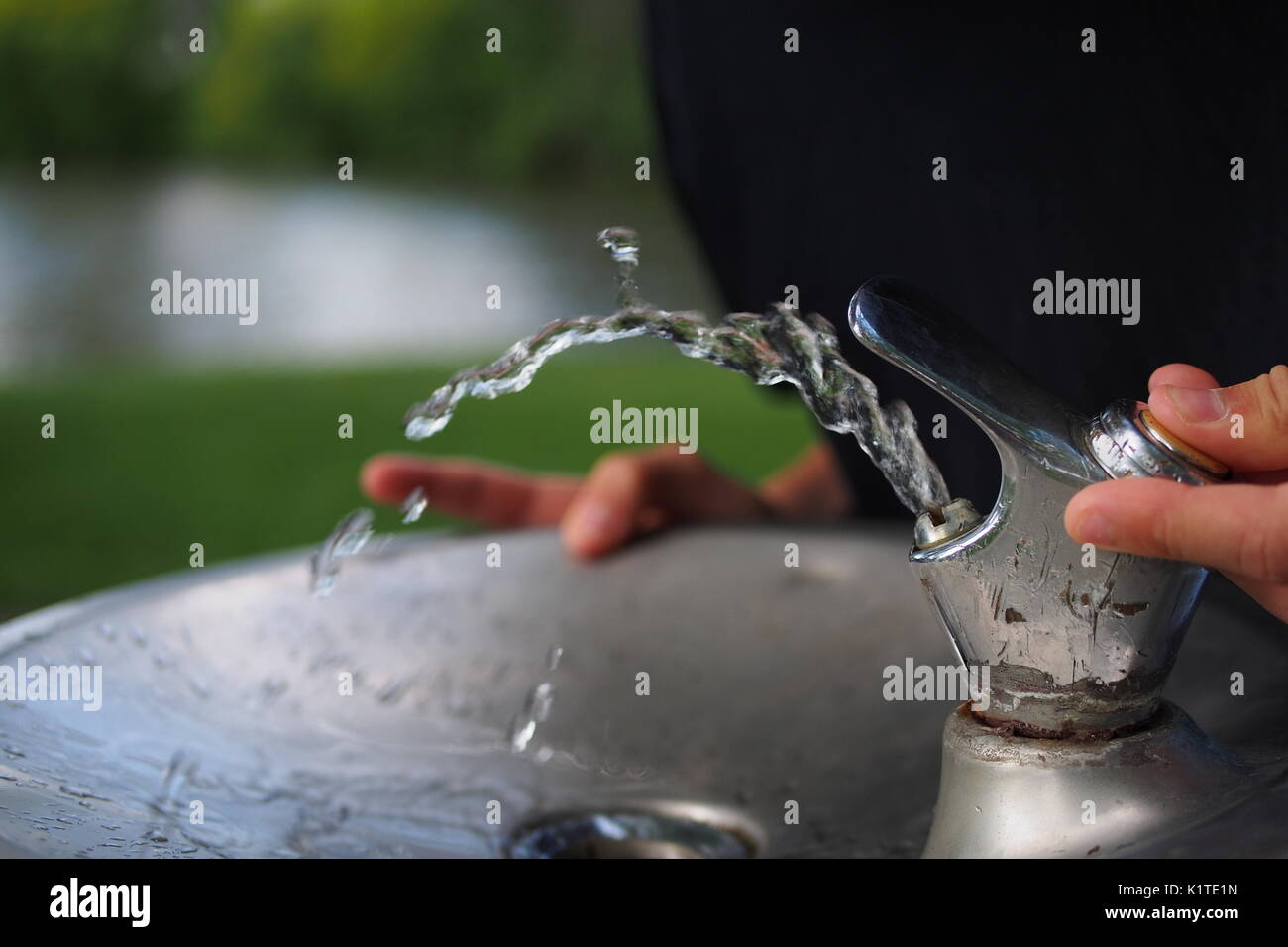 Water streams from a drinking fountain in the park, Ottawa, Ontario