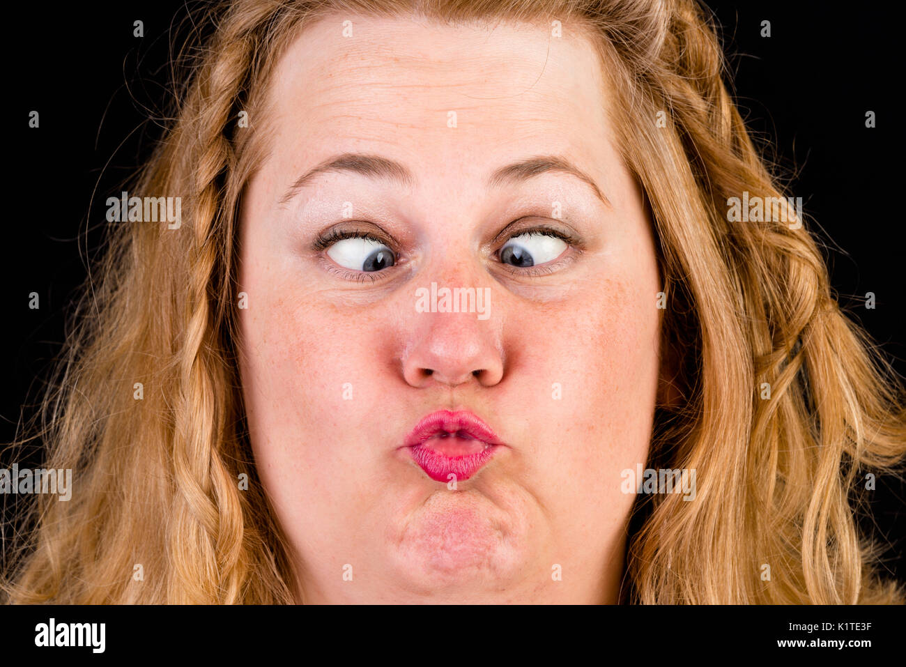 Portrait of attractive light overweighted mid aged woman showin  Stock Photo