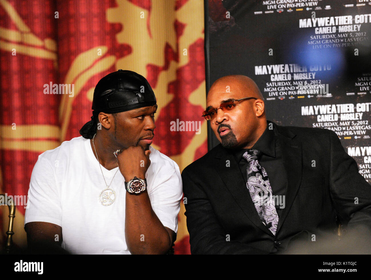Rapper 50 Cent (l) Leonard Ellerbe attends press conference Grauman's Chinese Theatre Hollywood March 1,2012. Mayweather Cotto will meet WBA Super Welterweight World Championship fight May 5 MGM Grand Las Vegas. Stock Photo