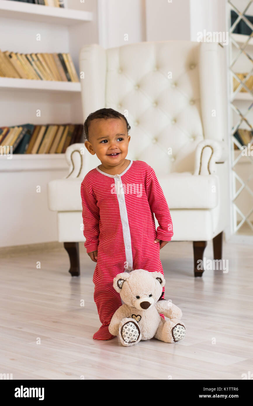 Full length portrait of mixed race baby boy in the home Stock Photo - Alamy